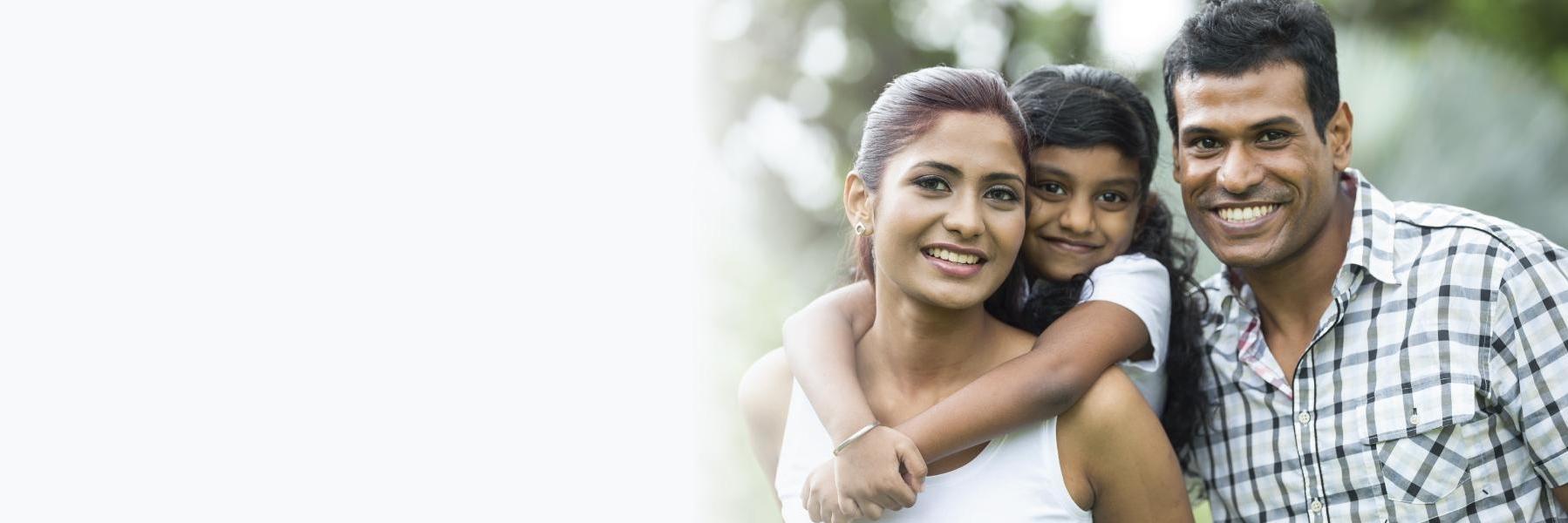 Family smiling after dental treatment at Cook Family Dental