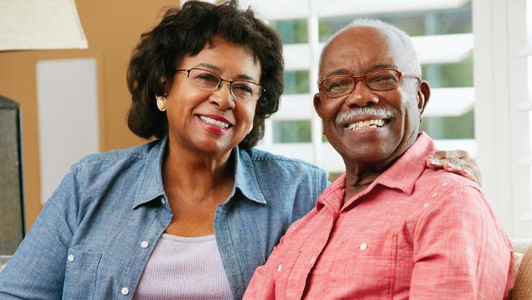 An smiling elderly black couple with dentures in Birmingham, AL