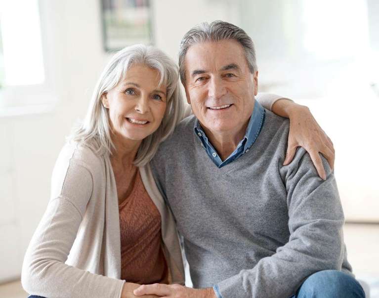 A couple smiling after Dental Implants in Birmingham, AL 