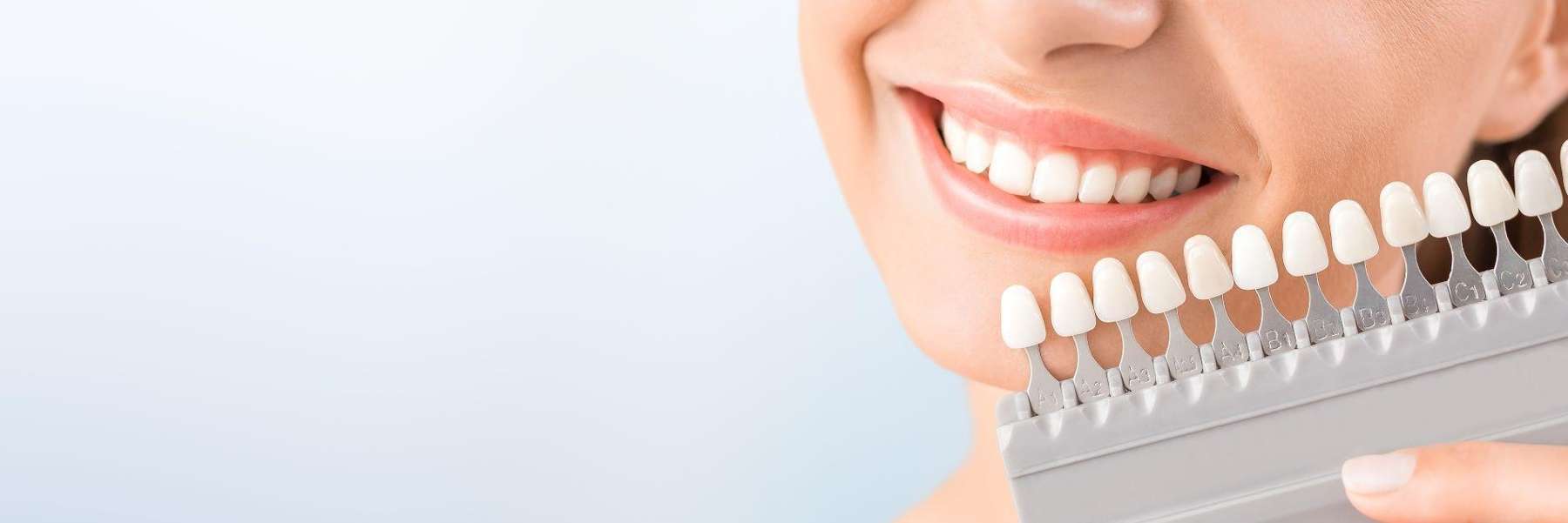 A woman holding an teeth whitening shade in in Birmingham, AL