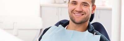 Man relaxing on dental chair before emergency treatment at Cook Family Dental