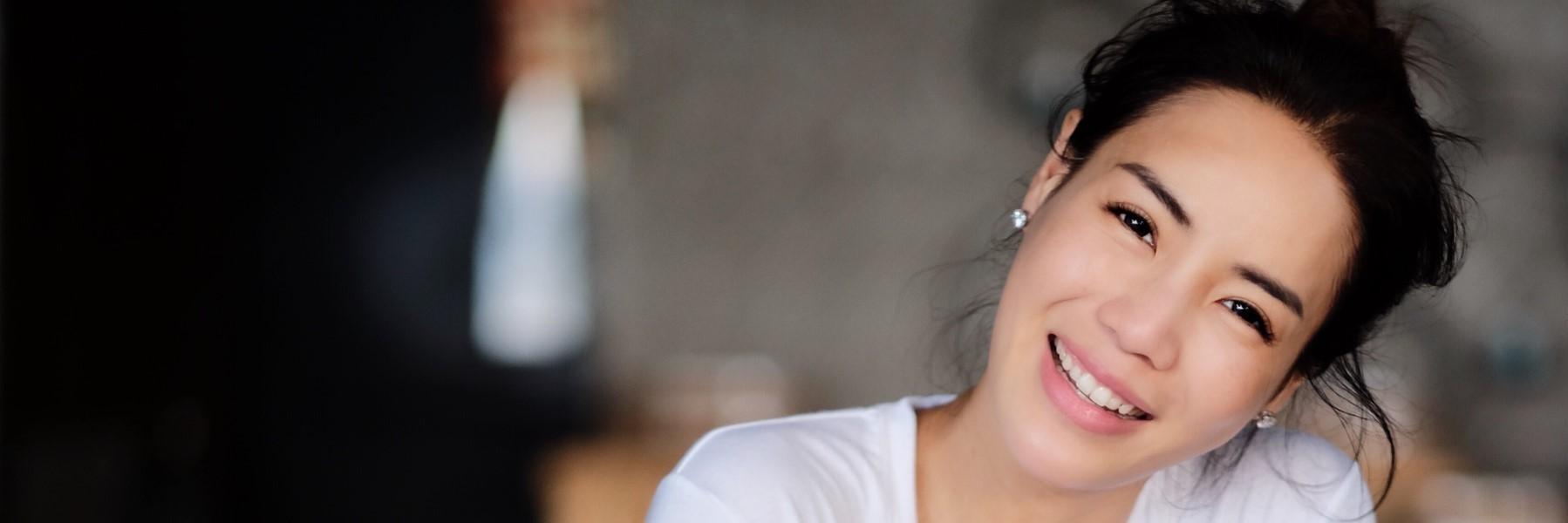 Woman with dental crowns smiling